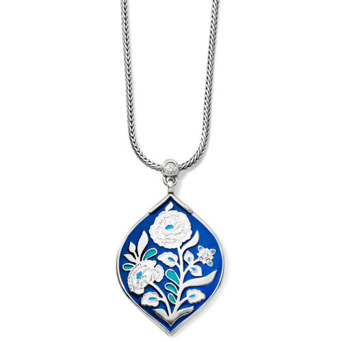 Journey To India Indigo Short Necklace The famed Blue Room at the City Palace in Jaipur, India, inspired this hand-enameled pendant featuring blue and white marigold flowers. With its engraving on back, this short silver necklace it totally reversible. Style: #JM3433 Collection: Journey to India Color: Silver-Blue Closure: Lobster Claw Length: 16" - 19" Adjustable Pendant Drop: 1 1/2" Material: Swarovski crystal, Enamel Finish: Silver plated Suggested Retail Price: $68.00